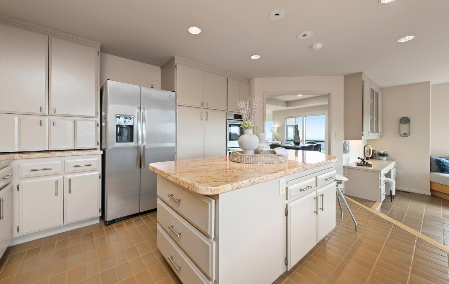 22365 Regnart Road Cupertino, CA 95014 - Photo 21 of 54 a kitchen with white cabinets appliances and a counter top space
