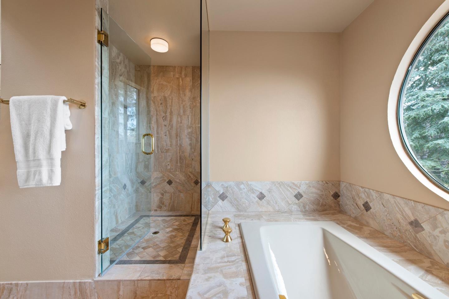 22365 Regnart Road Cupertino, CA 95014 - Photo 27 of 54 a bathroom with a granite countertop sink a shower and a mirror