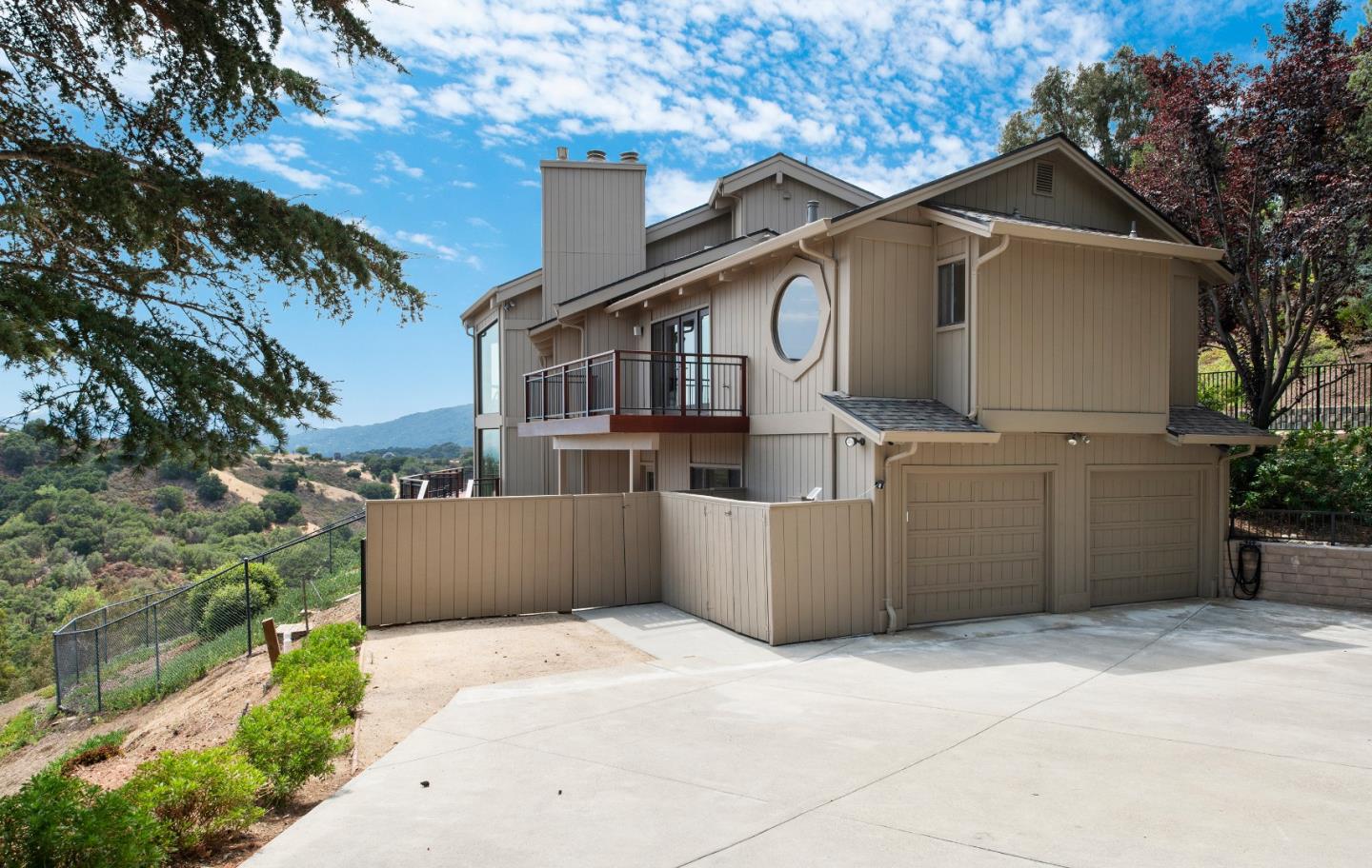 22365 Regnart Road Cupertino, CA 95014 - Photo 3 of 54 a front view of a house with a garage