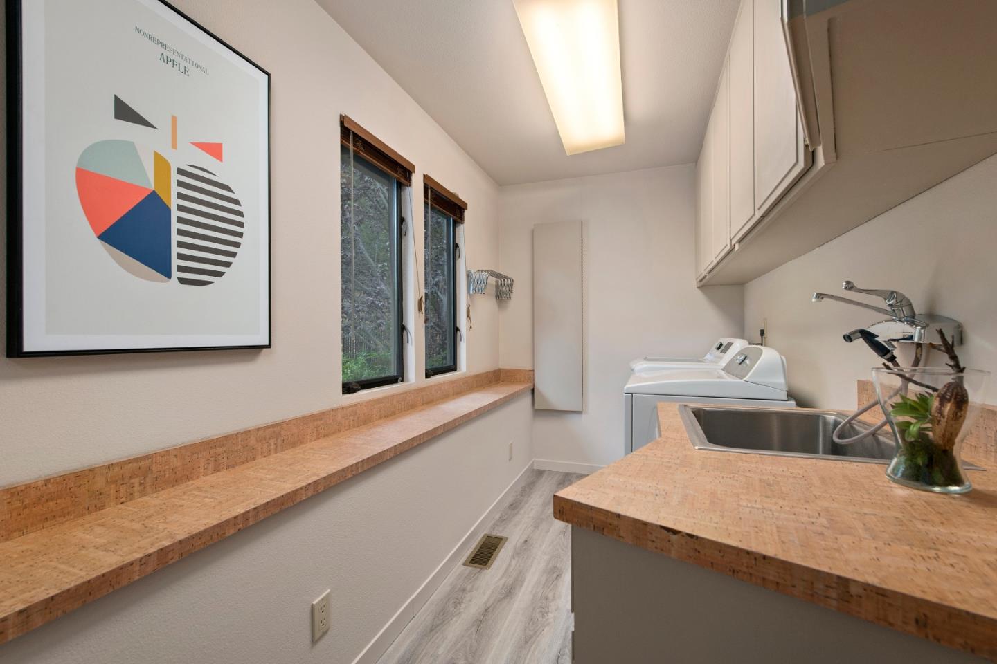 22365 Regnart Road Cupertino, CA 95014 - Photo 31 of 54 a bathroom with a sink and a mirror