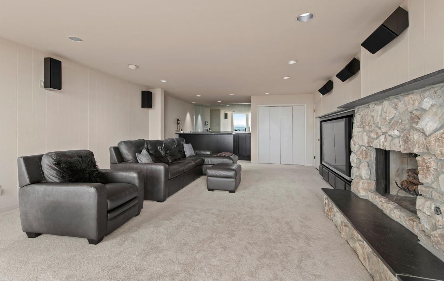 22365 Regnart Road Cupertino, CA 95014 - Photo 34 of 54 a living room with furniture and a fireplace