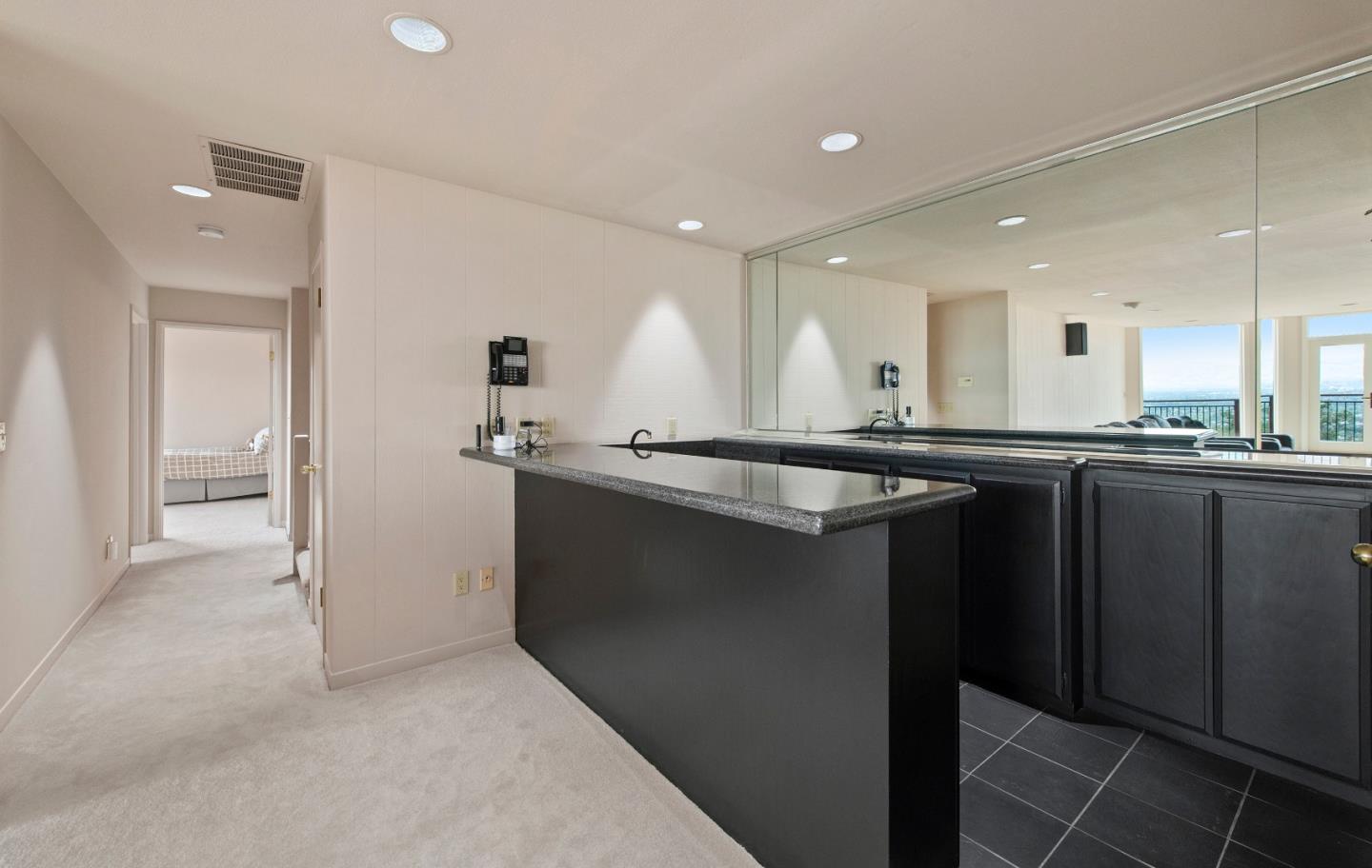 22365 Regnart Road Cupertino, CA 95014 - Photo 35 of 54 a kitchen with stainless steel appliances granite countertop a sink and cabinets