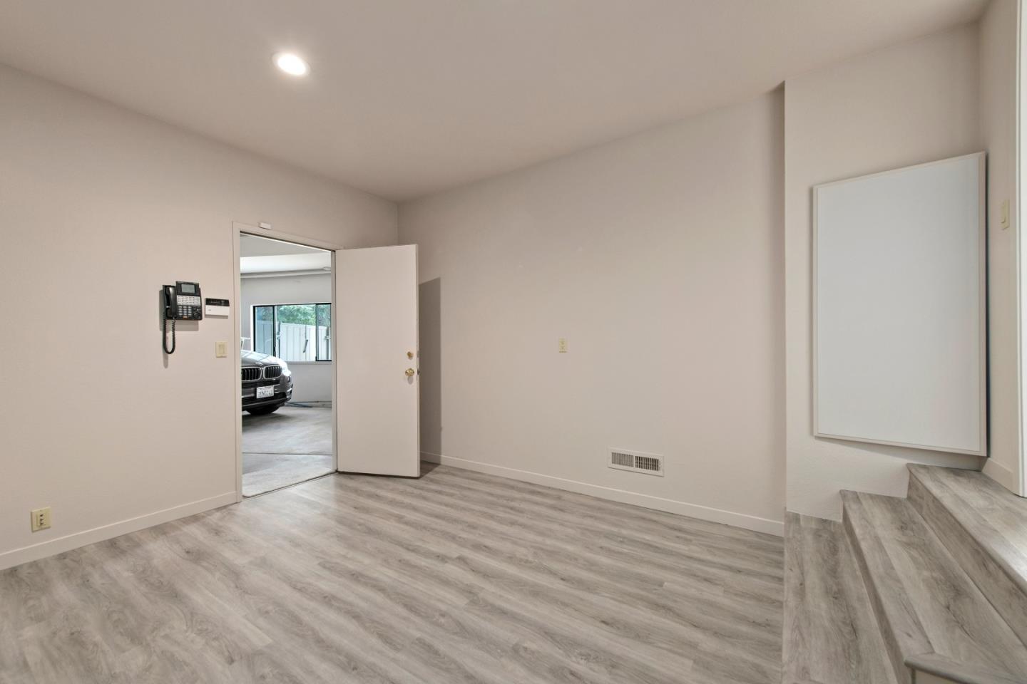 22365 Regnart Road Cupertino, CA 95014 - Photo 36 of 54 a view of empty room with wooden floor