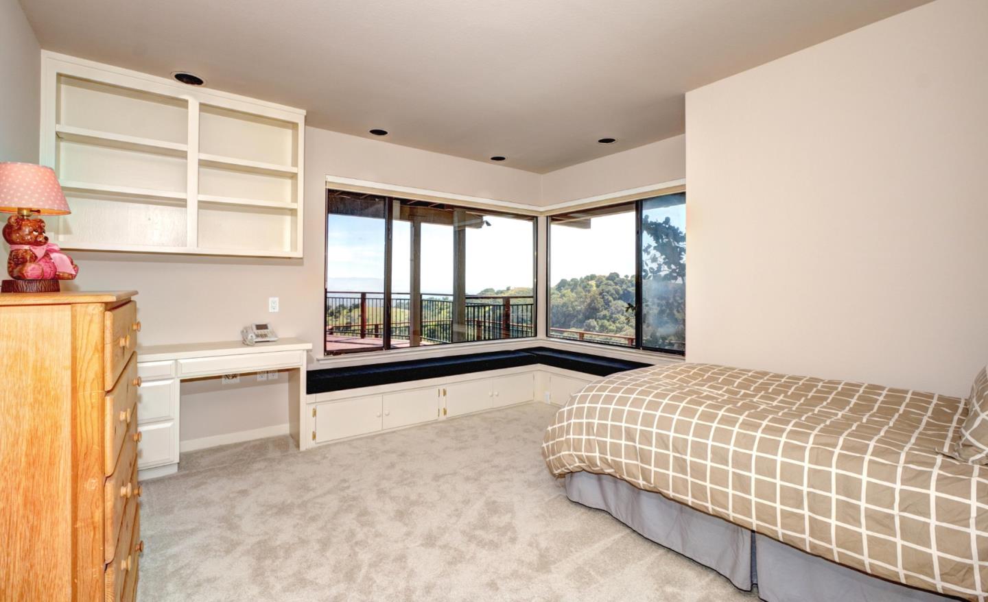 22365 Regnart Road Cupertino, CA 95014 - Photo 39 of 54 a bedroom with a bed and a large window