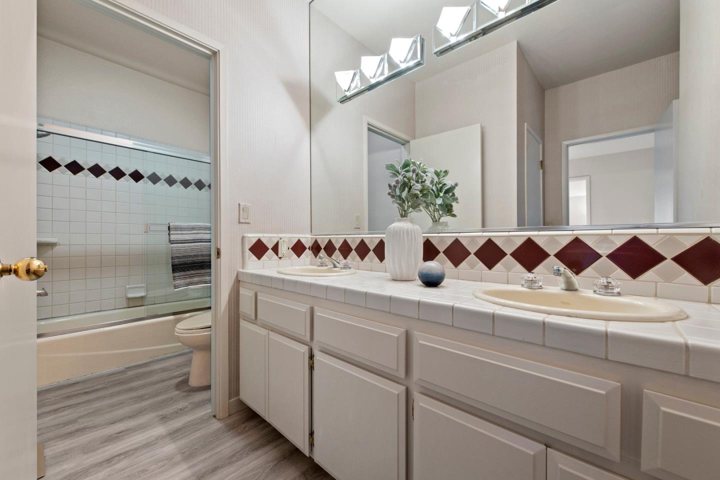 22365 Regnart Road Cupertino, CA 95014 - Photo 41 of 54 a bathroom with a sink and a mirror