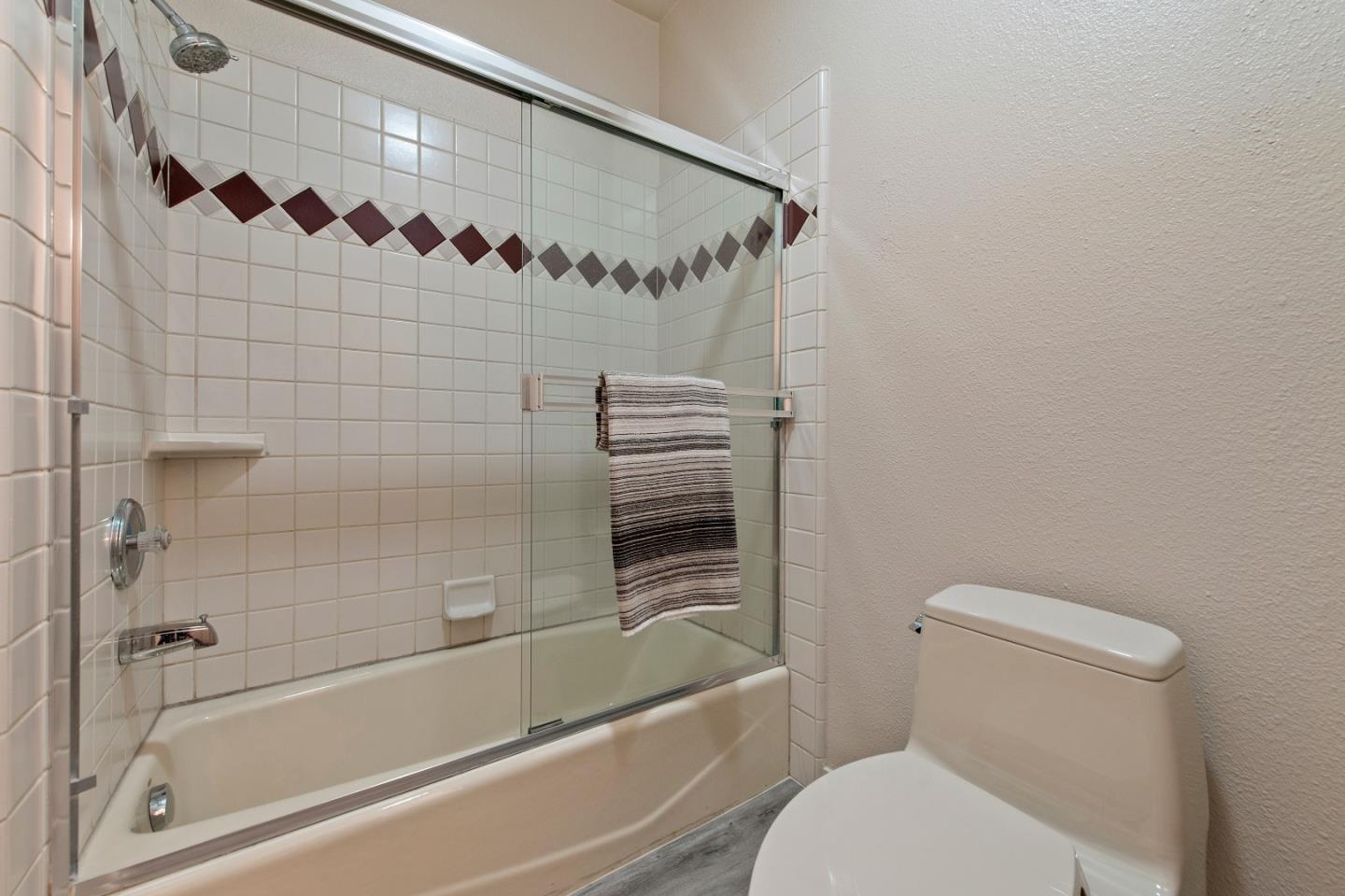 22365 Regnart Road Cupertino, CA 95014 - Photo 42 of 54 a bathroom with a toilet and a shower