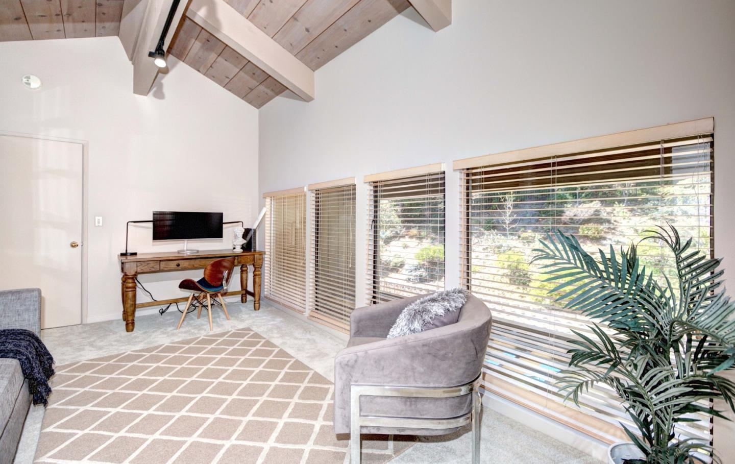 22365 Regnart Road Cupertino, CA 95014 - Photo 43 of 54 a living room with furniture and a flat screen tv