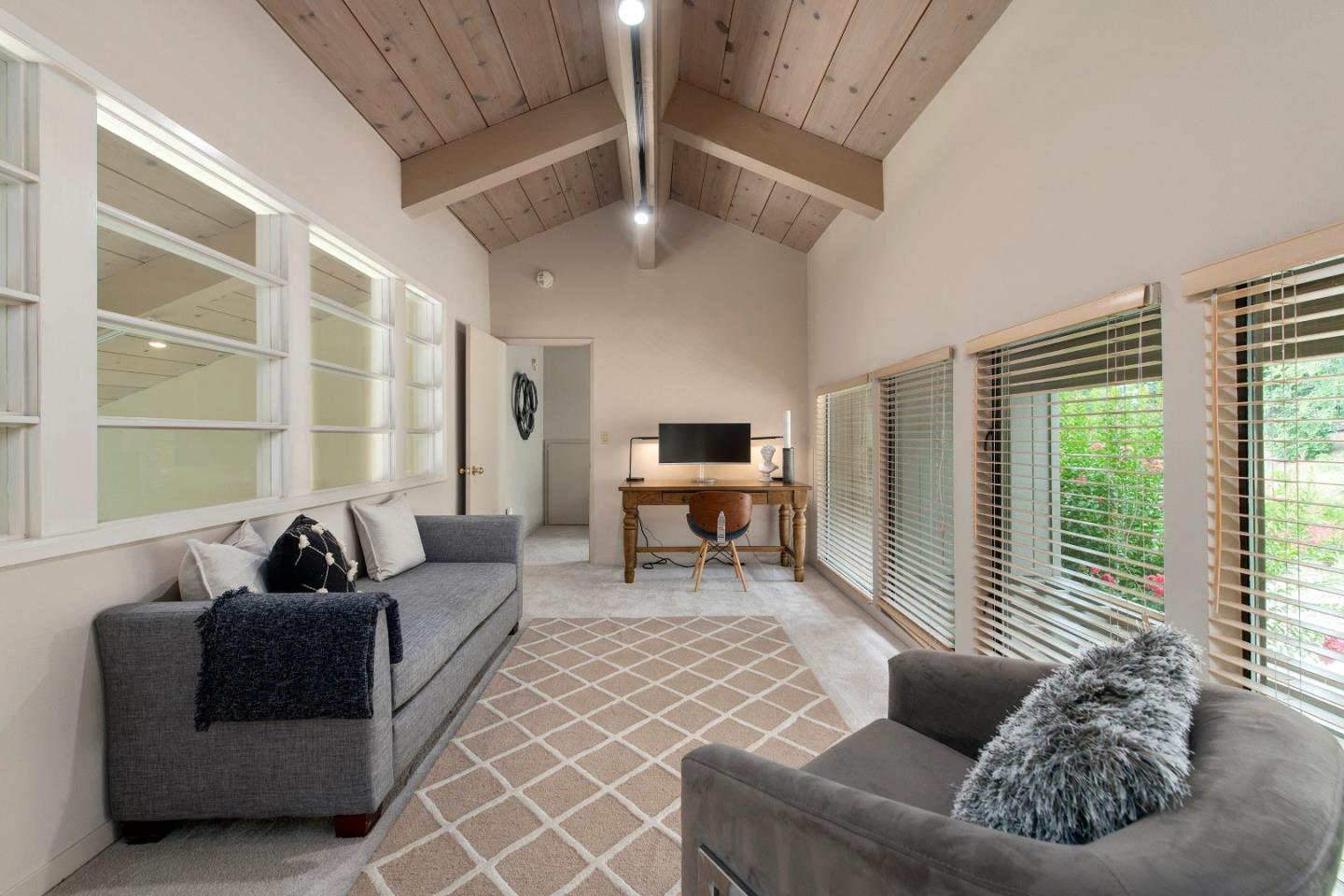22365 Regnart Road Cupertino, CA 95014 - Photo 44 of 54 a living room with furniture and a large window