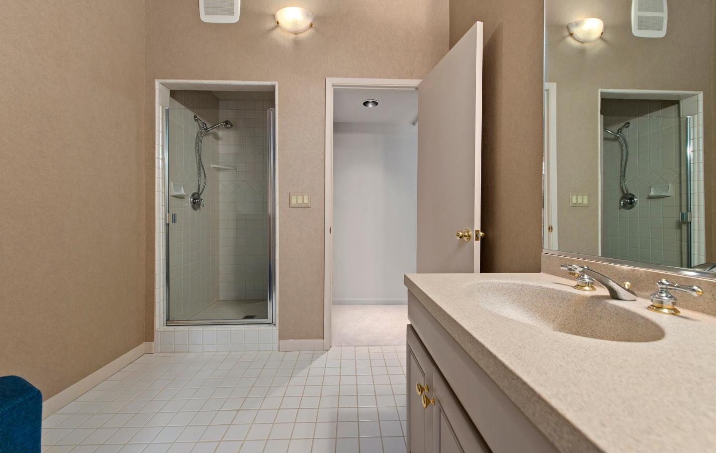 22365 Regnart Road Cupertino, CA 95014 - Photo 48 of 54 a bathroom with a sink and a mirror