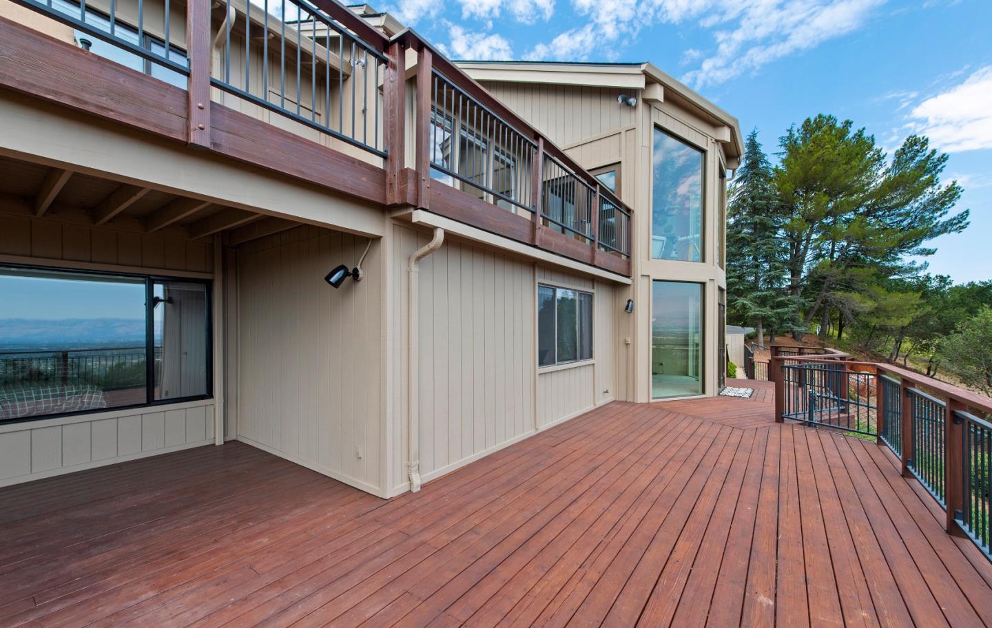 22365 Regnart Road Cupertino, CA 95014 - Photo 50 of 54 a view of a house with a deck
