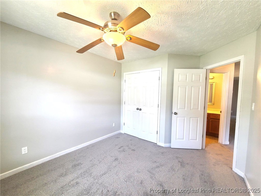 6521 Applewhite Road Fayetteville, NC 28304 - Photo 12 of 22 wooden floor in an empty room and a ceiling fan