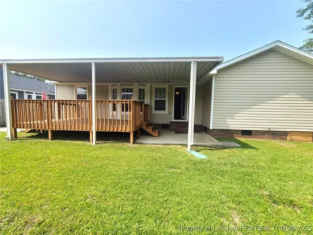 a backyard of a house with barbeque oven