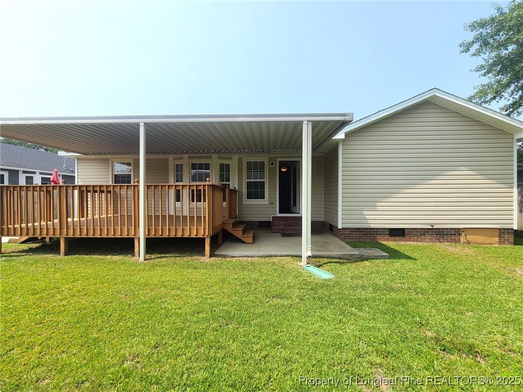 6521 Applewhite Road Fayetteville, NC 28304 - Photo 18 of 22 a view of an house with backyard and porch