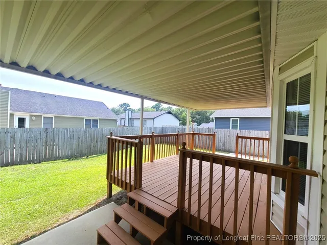a view of a deck with a backyard