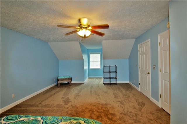 1051 Academy Road Lebanon, TN 37087 - Photo 19 of 20 a view of a room with a hanging space and ceiling fan