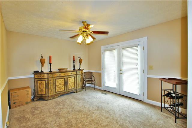1051 Academy Road Lebanon, TN 37087 - Photo 2 of 20 a view of a livingroom with furniture and chandelier fan