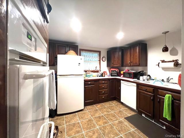 250 County Road 21 Barryville, NY 12719 - Photo 4 of 18 a kitchen with a refrigerator sink and cabinets