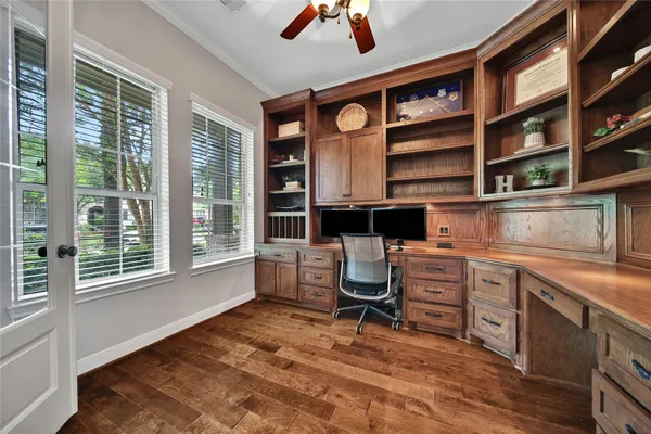 a kitchen with stainless steel appliances granite countertop a stove a sink dishwasher and cabinets next to a window