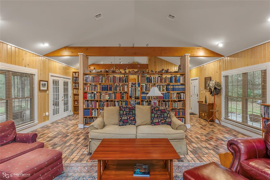 3100 Herren Road Doyline, LA 71023 - Photo 11 of 40 a living room with furniture and a floor to ceiling window