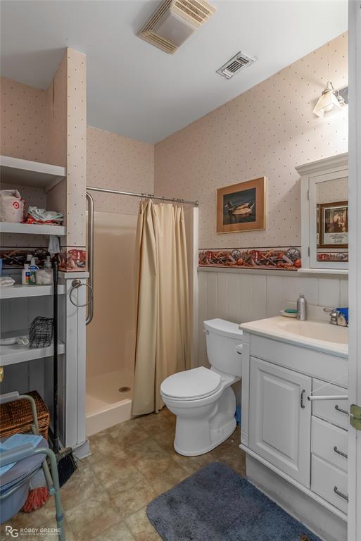 3100 Herren Road Doyline, LA 71023 - Photo 35 of 40 a bathroom with a sink toilet and shower