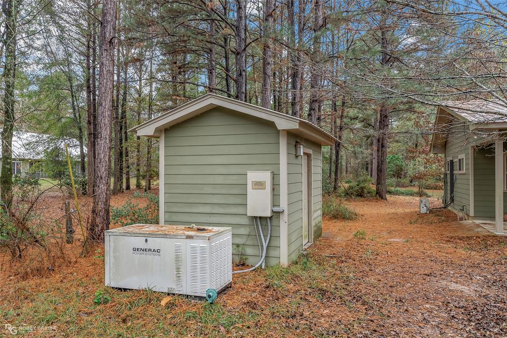 3100 Herren Road Doyline, LA 71023 - Photo 6 of 40 a backyard of a house with lots of green space