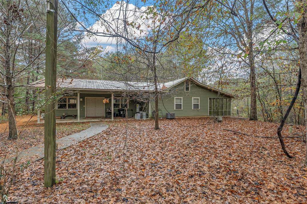 3100 Herren Road Doyline, LA 71023 - Photo 7 of 40 a house with trees in the background