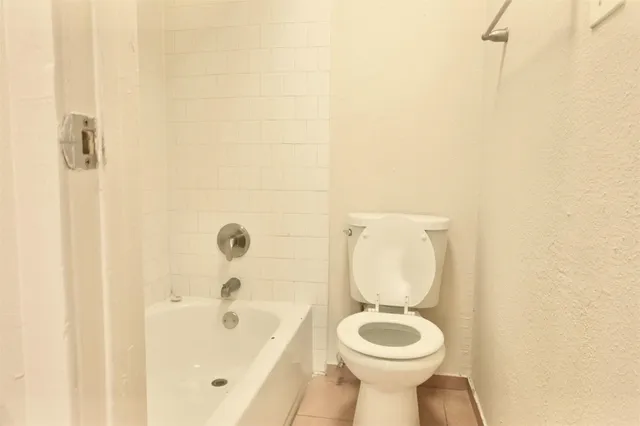 a bathroom with a toilet and a sink