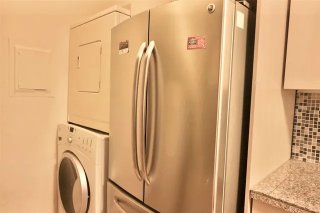 a view of a bathroom with a shower and a sink