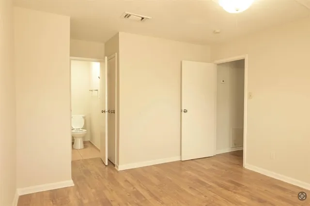 a view of bathroom with a shower and a toilet