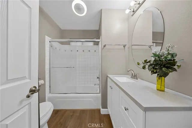 a bathroom with a sink a mirror and shower