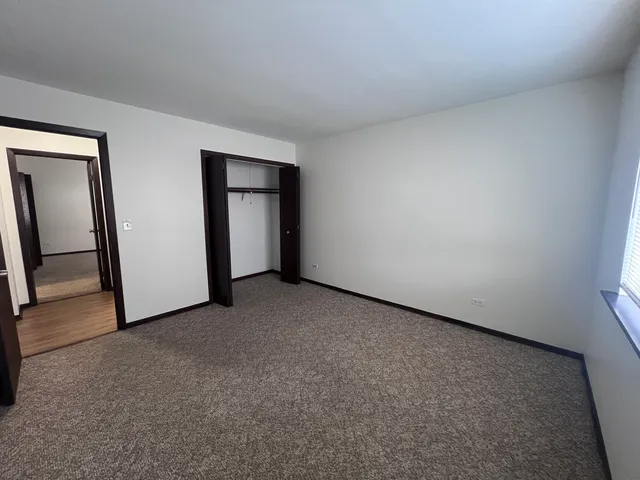 an empty room with a mirror