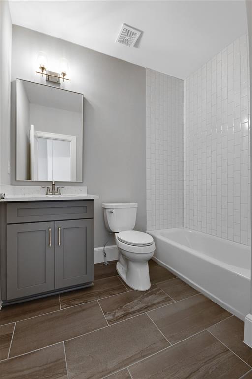 3510 Vermillion View Suwanee, GA 30024 - Photo 30 of 44 a bathroom with a toilet sink and mirror