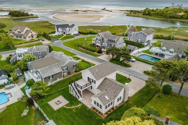 an aerial view of a house with a ocean view