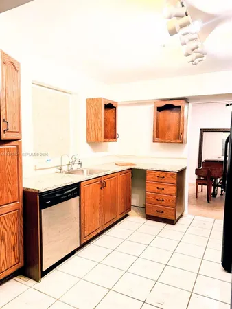a kitchen with stainless steel appliances a cabinets and a counter top space