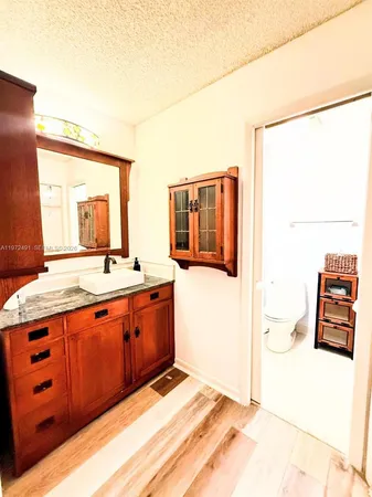 a bathroom with a sink a mirror and a shower