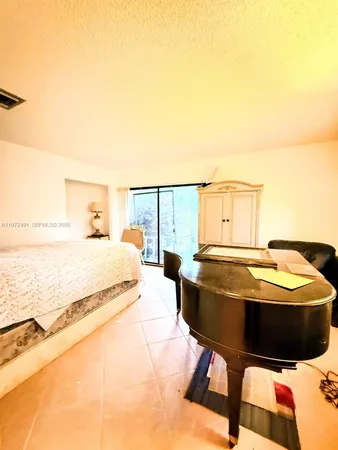 a living room with a table and chairs