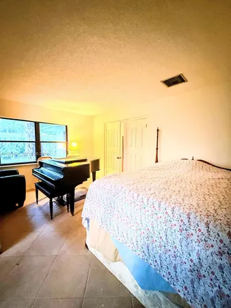 a swimming pool with outdoor seating and yard