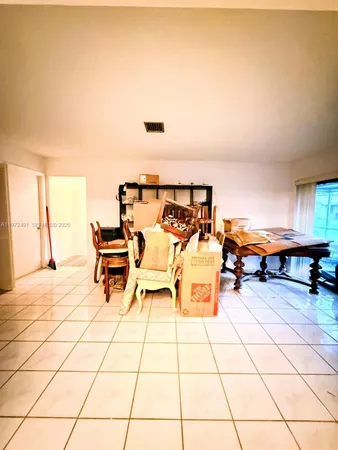 a outdoor space with lots of furniture and white walls