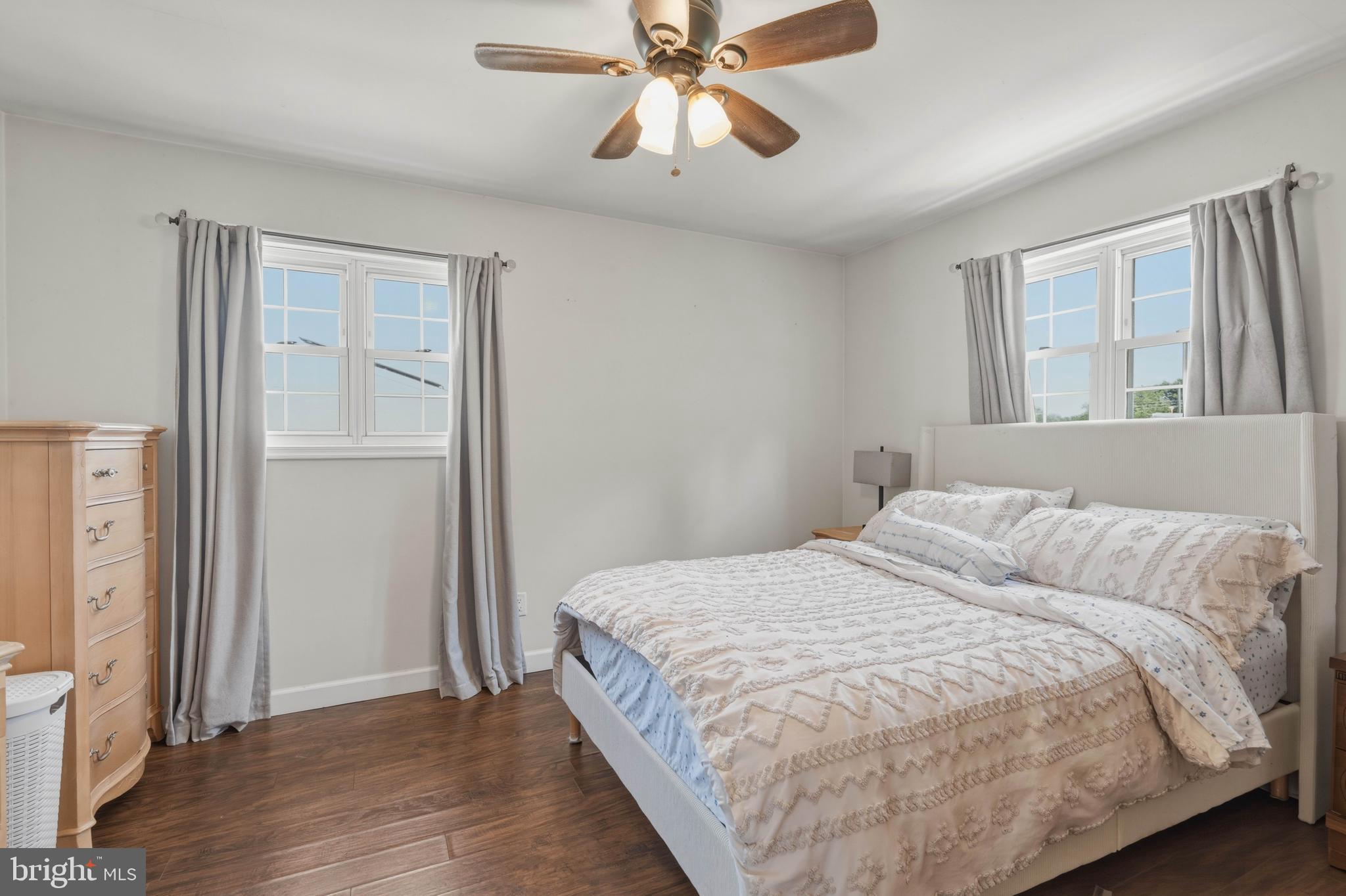 276 Madison Road Mantua, NJ 08051 - Photo 18 of 30 a bedroom with a bed and a chandelier