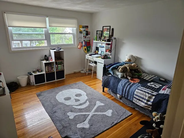 a view of a livingroom with furniture and an empty room