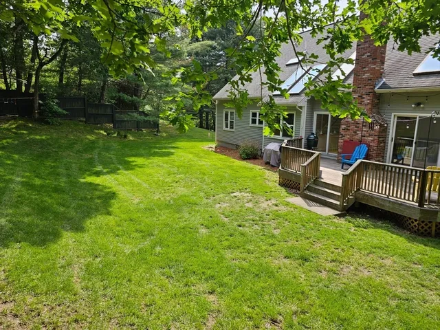a view of a chair and table in the garden