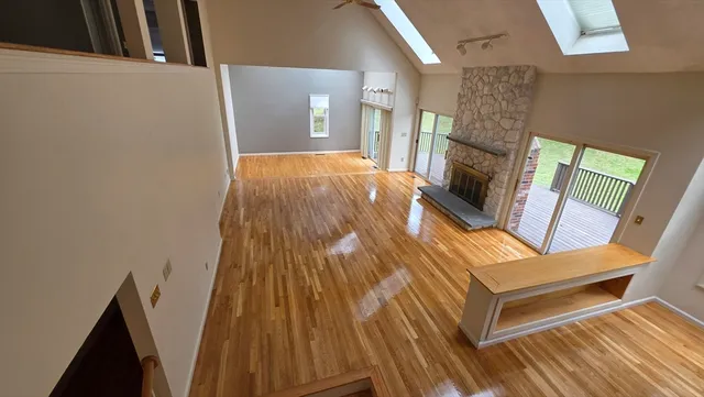 a view of a livingroom with furniture window and wooden floor