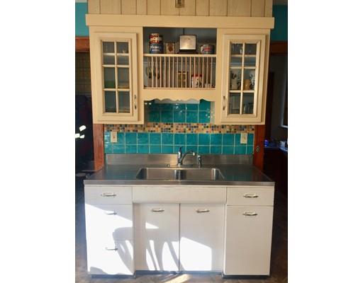 114 Belchertown Street Three Rivers, MA 01080 - Photo 6 of 27 a kitchen with a sink and cabinets
