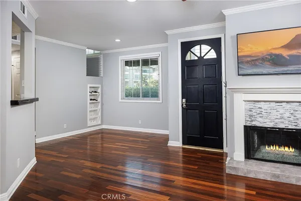 a view of empty room with window and fireplace