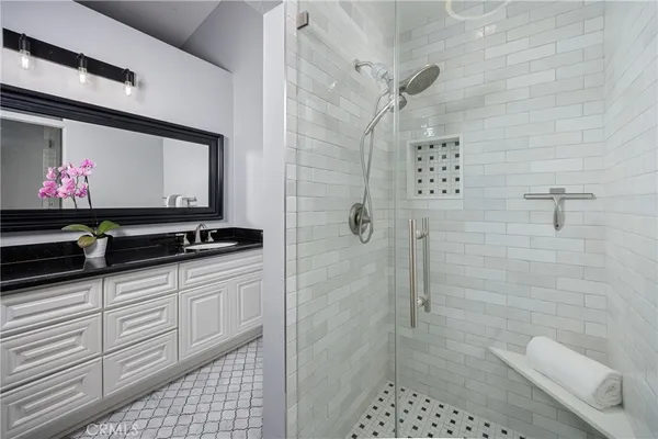 a bedroom with furniture and a wooden floor