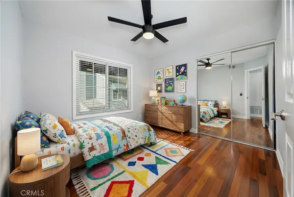 a view of room with window and a ceiling fan