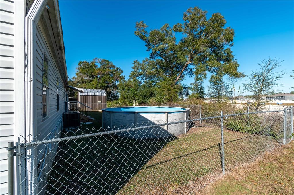 6601 Southwest 84th Street Ocala, FL 34476 - Photo 7 of 36 a view of a chairs and table in the balcony