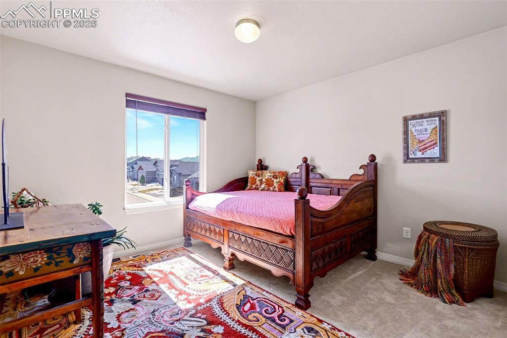 778 Gold Canyon Road Monument, CO 80132 - Photo 29 of 43 Upper level bedroom - beautiful natural light!