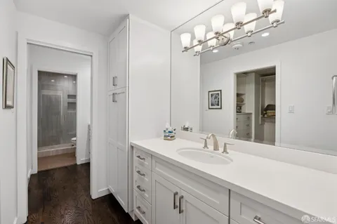 a bathroom with a sink double vanity and a mirror