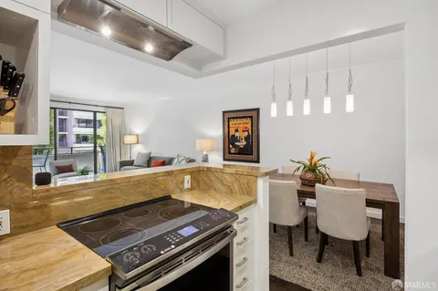 a dining room with furniture and a piano